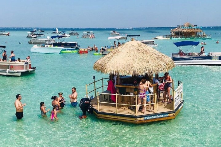 a group of people on a boat in the water